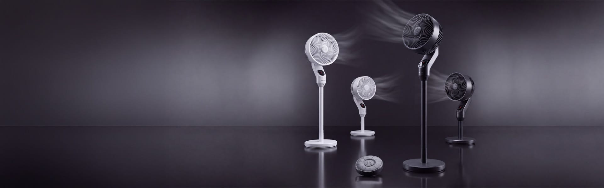 Opranic A70R pedestal fan and desk fan in white and black, with visible airflow in a dark studio