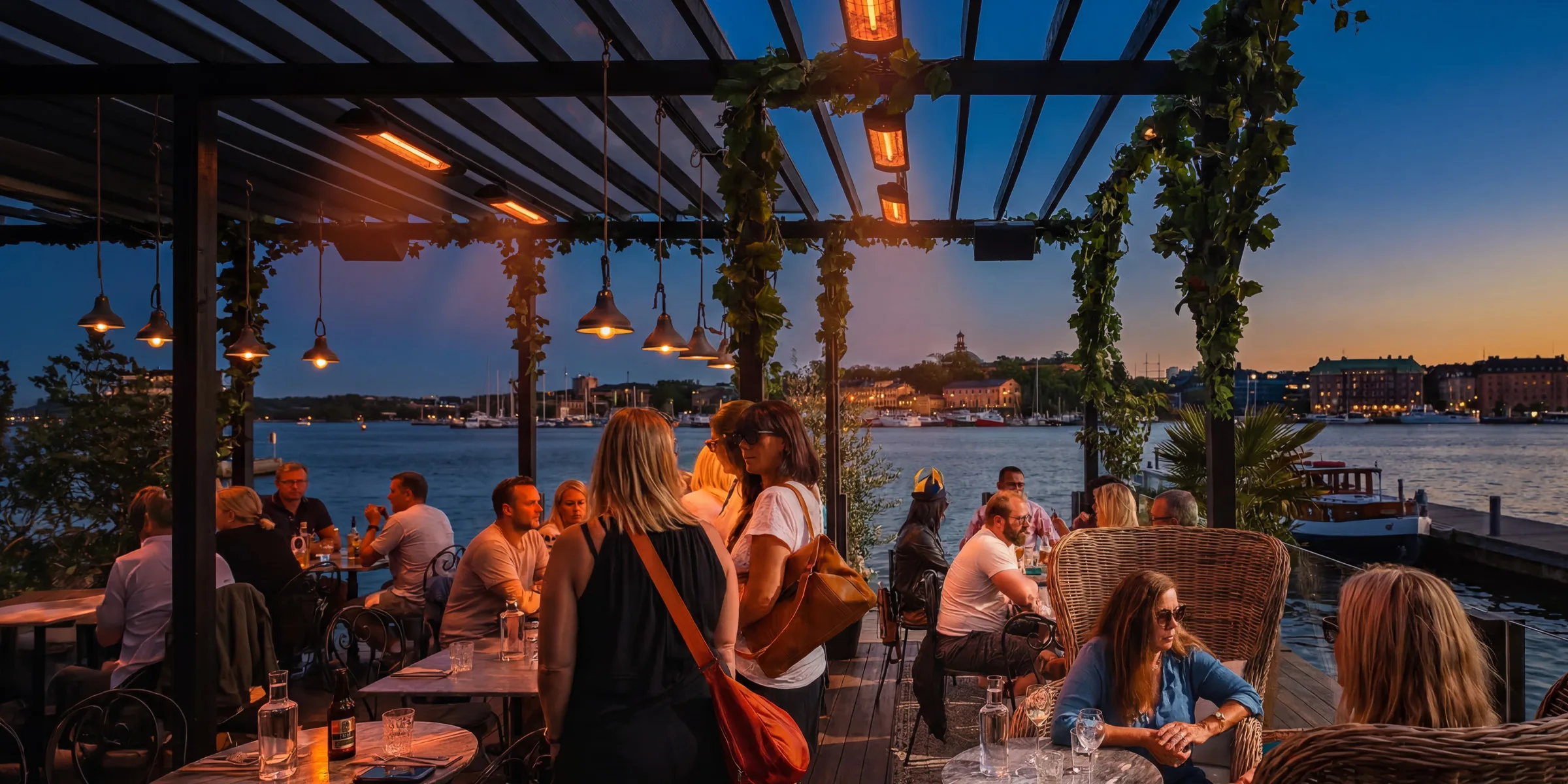 Restaurant terrace with overhead infrared heaters at dusk